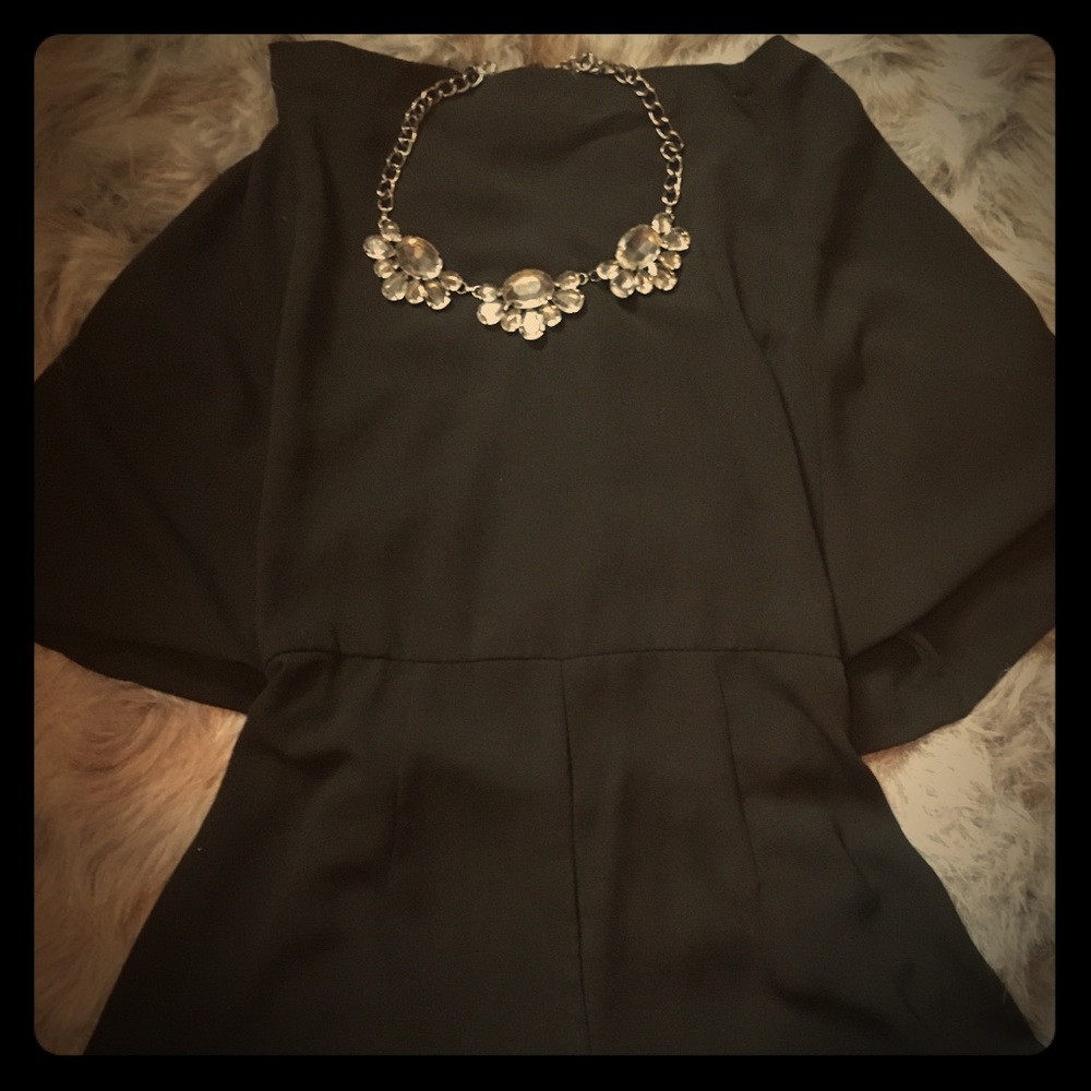 Black button up romper.